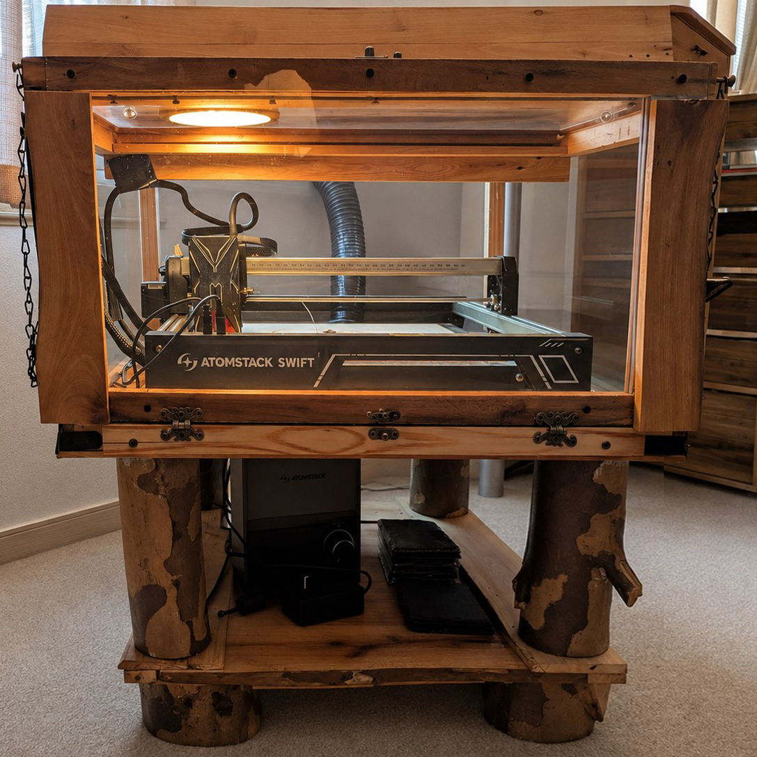 Custom wooden enclosure housing the Cattywampus laser cutter